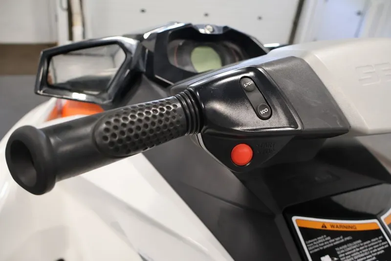 Slide: The Image of Close-up of 2014 Sea-Doo GTI 130 handlebar controls with sport and eco mode buttons. - 11