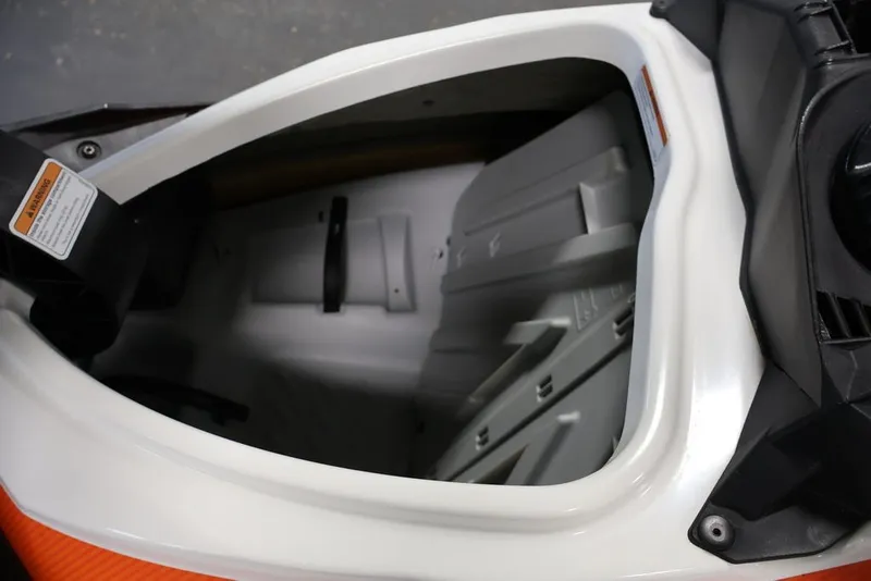 Slide: The Image of 2014 Sea-Doo GTI 130 storage compartment, showcasing spacious interior design. - 13