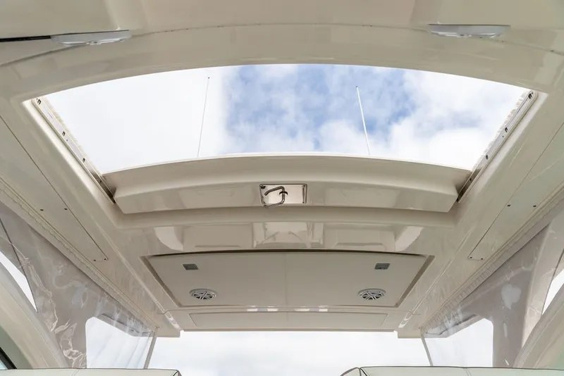 Slide: The Image of Open sunroof of 2024 Tiara Yachts 34 LX, showcasing clear sky view. - 26