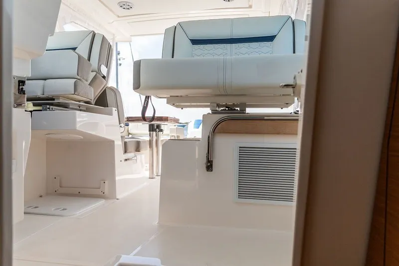 Slide: The Image of 2024 Tiara Yachts 34 LX interior with luxurious seating and modern design. - 16