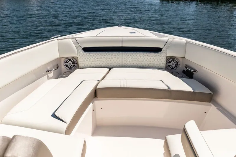 Slide: The Image of Luxurious seating area on 2024 Tiara Yachts 34 LX, featuring elegant upholstery and speakers. - 30