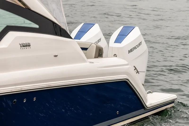 Slide: The Image of 2024 Tiara Yachts 34 LX with dual Mercury engines on water. - 8