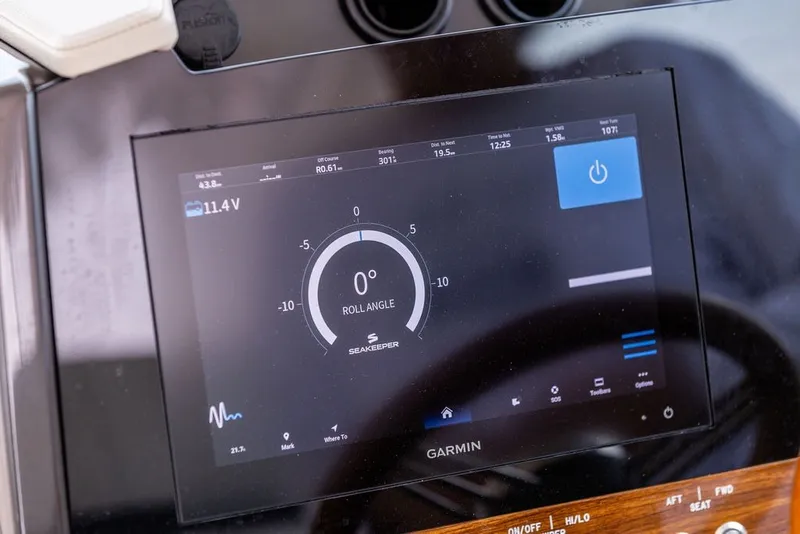 Slide: The Image of Garmin display on 2024 Tiara Yachts 34 LX showing roll angle and navigation data. - 20