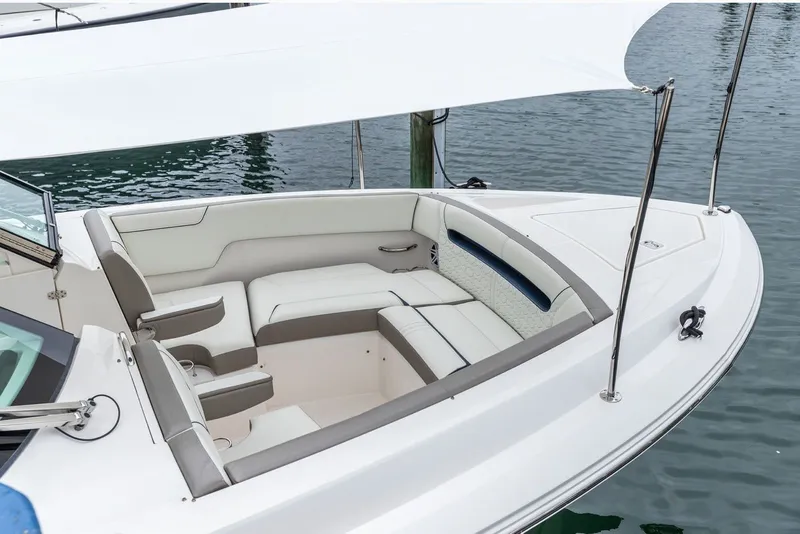 Slide: The Image of The 2024 Tiara Yachts 34 LX features an elegant, cushioned seating area under a sunshade. - 1