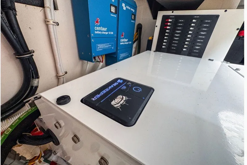 Slide: The Image of Electrical system of 2024 Tiara Yachts 34 LX, featuring Centaur battery chargers. - 47