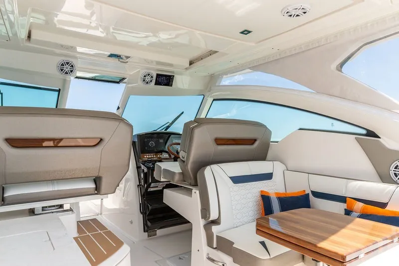 Slide: The Image of Luxurious interior of 2024 Tiara Yachts 34 LX with elegant seating and modern helm. - 23