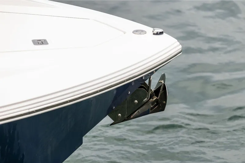 Slide: The Image of Bow of 2024 Tiara Yachts 34 LX with anchor over water. - 29