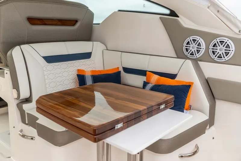 Slide: The Image of Luxurious interior of 2024 Tiara Yachts 34 LX with elegant seating and wooden table. - 37