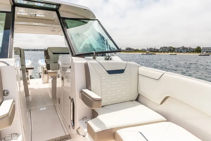 Slide: The Image of 2024 Tiara Yachts 34 LX luxury boat interior with waterfront view. - 33