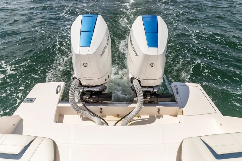 Slide: The Image of 2024 Tiara Yachts 34 LX with dual Mercury outboard engines on open water. - 40