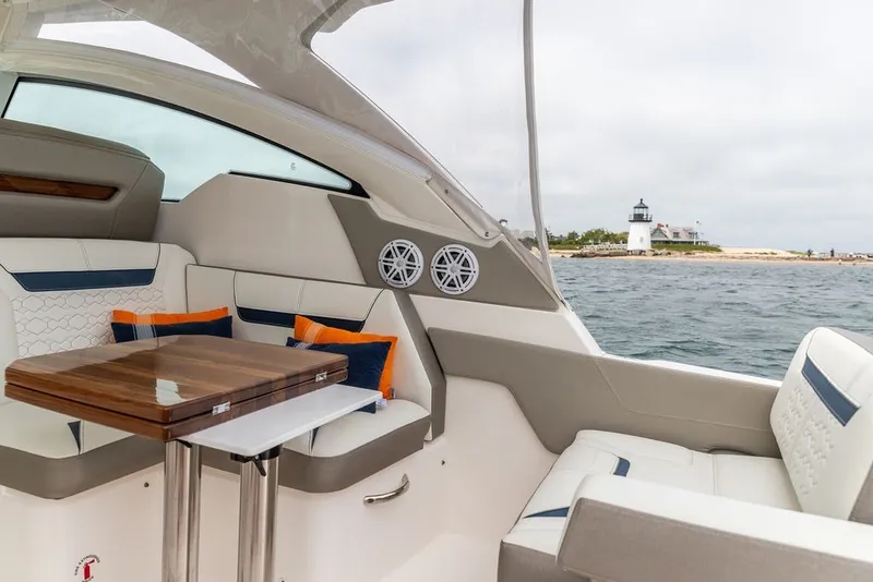 Slide: The Image of 2024 Tiara Yachts 34 LX interior with elegant seating and ocean view. - 36