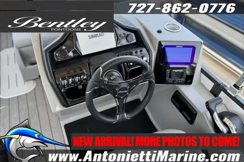 Slide: The Image of 2027 Bentley Pontoons Elite 253 Admiral dashboard with steering wheel and navigation system. - 7