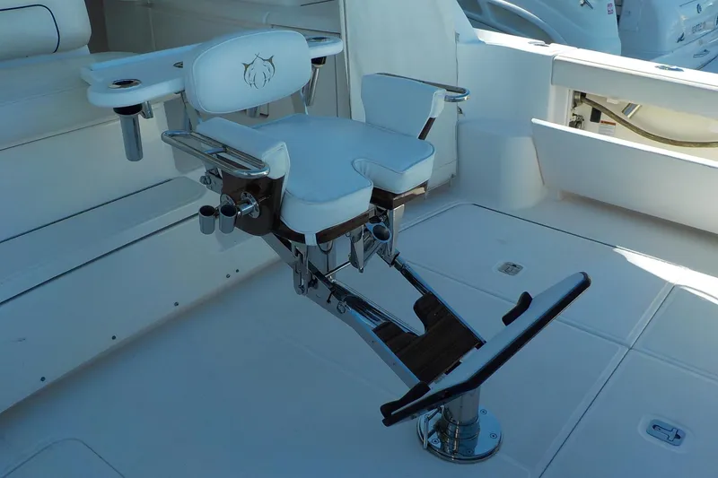 Slide: The Image of Luxury fishing chair on 2009 Tiara Yachts 3900 Open deck, featuring rod holders and footrest. - 23