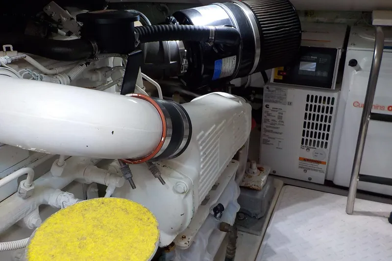 Slide: The Image of Engine room of 2009 Tiara Yachts 3900 Open, featuring Cummins Onan generator. - 39