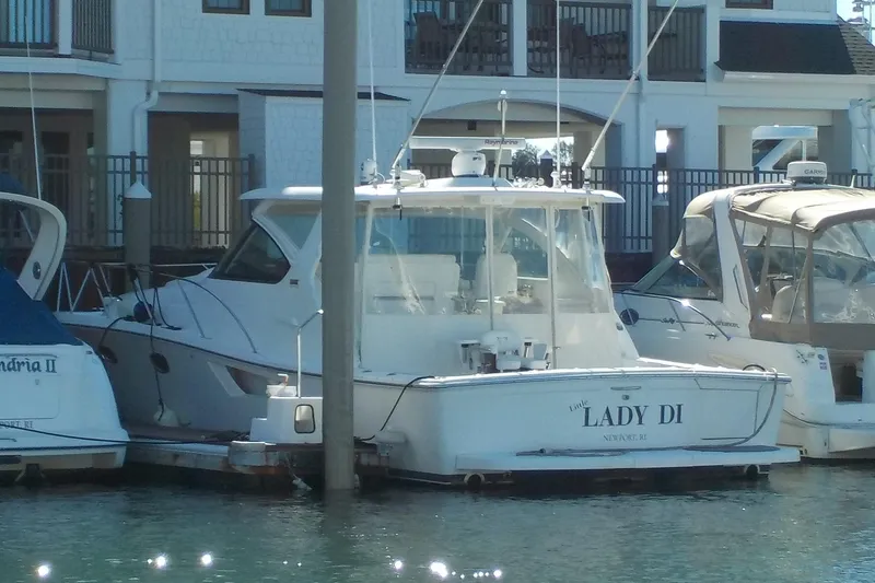 Slide: The Image of 2009 Tiara Yachts 3900 Open docked, named "Lady Di," in a marina setting. - 1