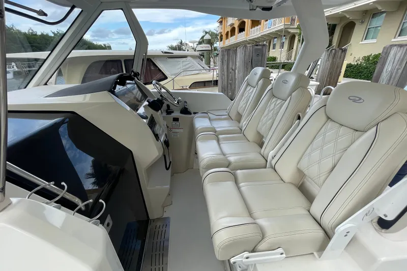 Slide: The Image of Luxurious interior of 2022 Regal 33 SAV boat with plush seating and modern dashboard. - 15