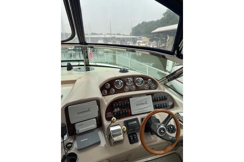 Slide: The Image of Helm of 2002 Sea Ray 360 Sundancer with Garmin navigation system and wood-accented steering wheel. - 7