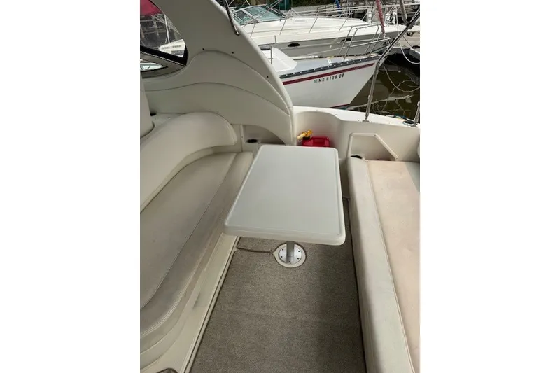 Slide: The Image of Interior seating area of 2002 Sea Ray 360 Sundancer yacht with table. - 10