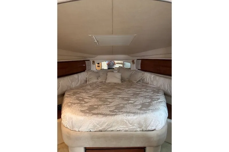 Slide: The Image of Luxurious cabin interior of 2002 Sea Ray 360 Sundancer yacht with plush bedding. - 15