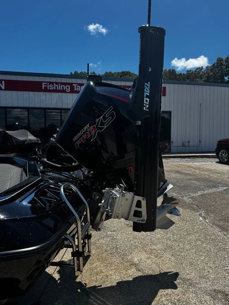 Slide: The Image of A 2021 Ranger Z521L with a Mercury Pro XS engine, parked in front of a building. - 17