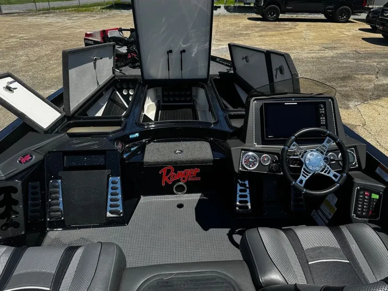 Slide: The Image of The image shows the cockpit of a 2021 Ranger Z521L boat with modern instruments and storage. - 11