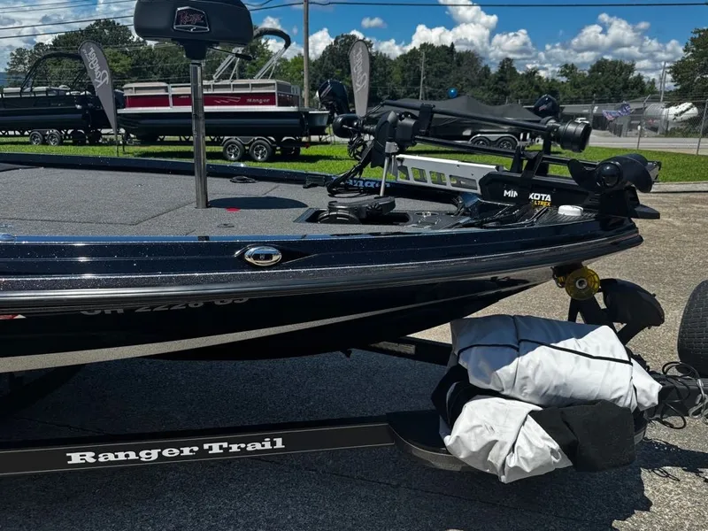 Slide: The Image of A 2021 Ranger Z521L on a trailer. It features a sleek design and is equipped with a Minn Kota motor. - 15