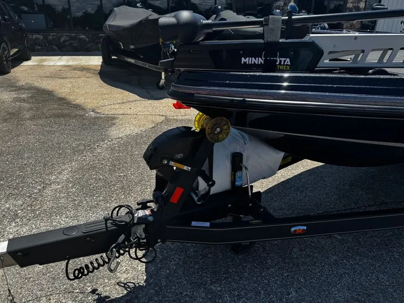 Slide: The Image of A 2021 Ranger Z521L boat on a trailer, featuring a Minn Kota trolling motor. - 14