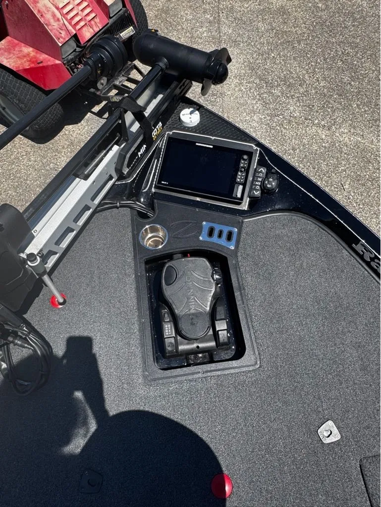 Slide: The Image of The image shows the cockpit of a 2021 Ranger Z521L boat with controls and electronics. - 10