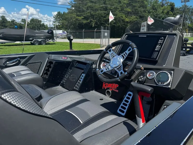 Slide: The Image of The image shows the cockpit of a 2021 Ranger Z521L boat with modern instruments and steering wheel. - 19