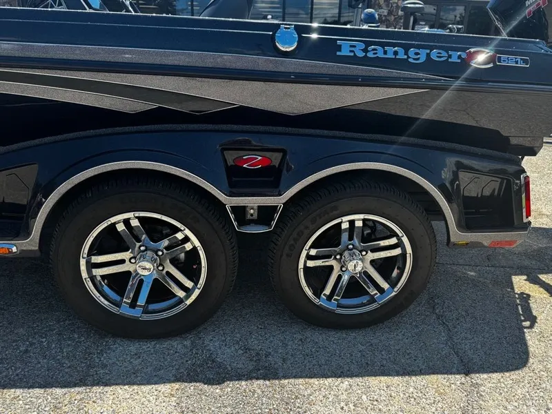 Slide: The Image of Close-up of a boat trailer with two shiny wheels and Ranger logo. - 2