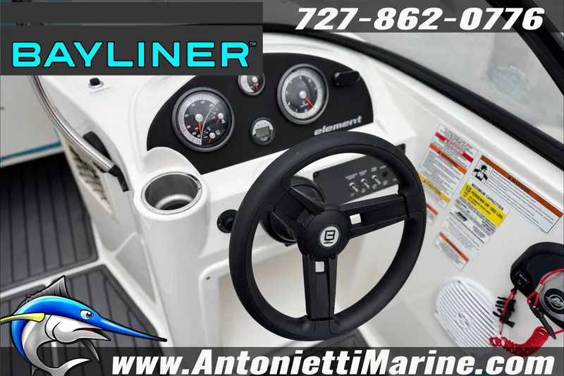 Slide: The Image of 2021 Bayliner Element E21 boat dashboard with steering wheel and gauges, featuring Antonietti Marine branding. - 19