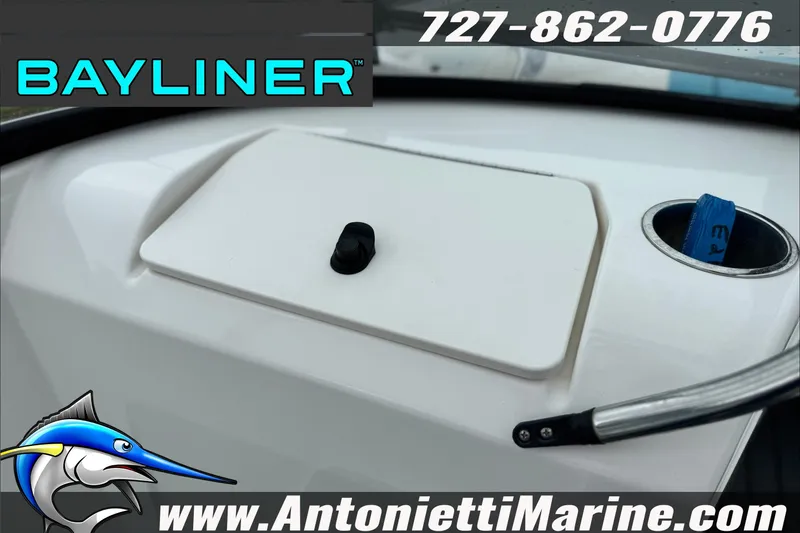 Slide: The Image of 2021 Bayliner Element E21 dashboard with storage compartment and cup holder, Antonietti Marine branding. - 24