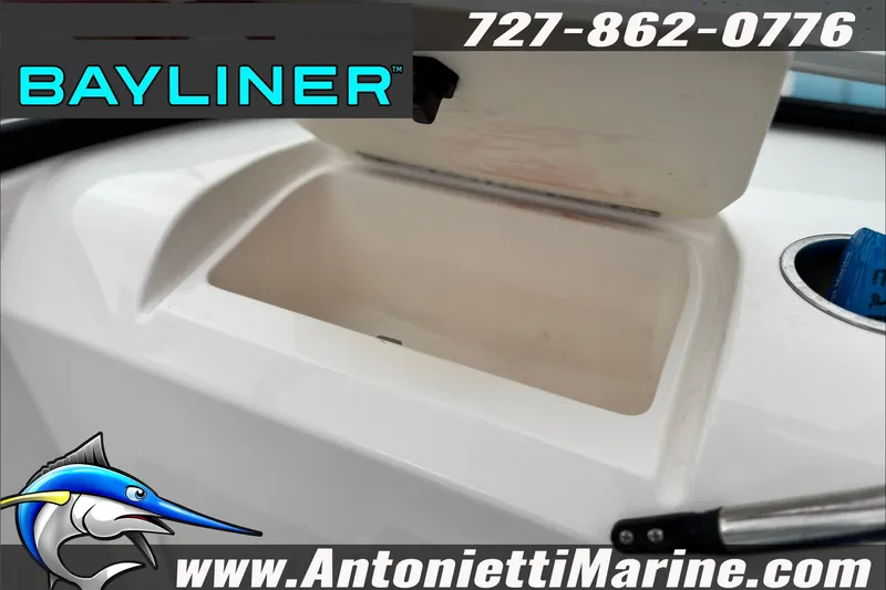 Slide: The Image of 2021 Bayliner Element E21 storage compartment, featuring logo and contact details for Antonietti Marine. - 25