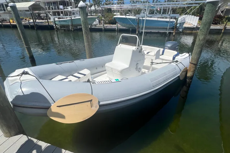 Slide: The Image of 2003 Nautica 22 Wide Body inflatable boat docked in a marina. - 10