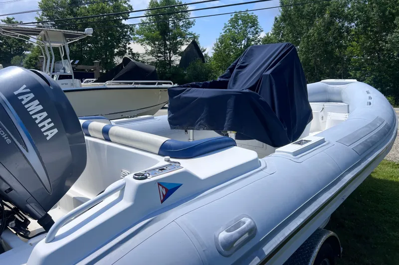 Slide: The Image of 2003 Nautica 22 Wide Body boat with Yamaha engine, parked outdoors. - 3