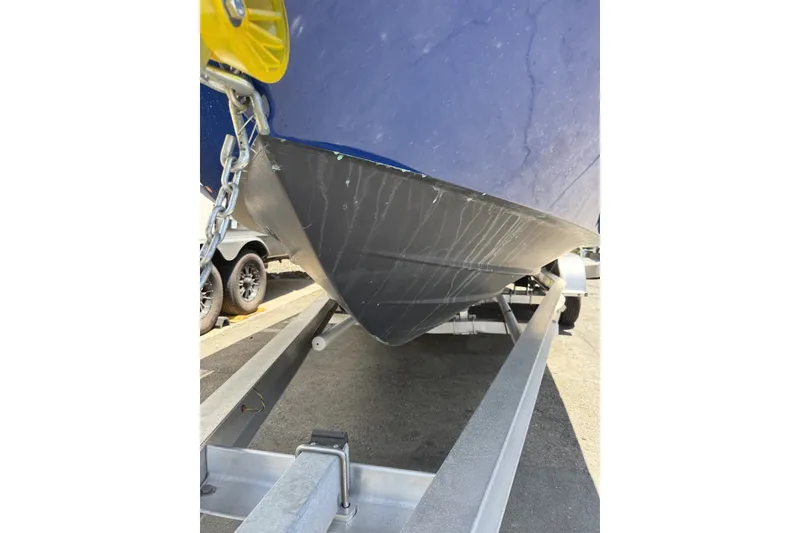 Slide: The Image of 2022 Bayliner Trophy T22CX boat hull on trailer, close-up view. - 8