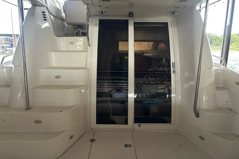 Slide: The Image of 2001 Regal Commodore 3780 yacht interior with stairs and sliding glass door. - 10