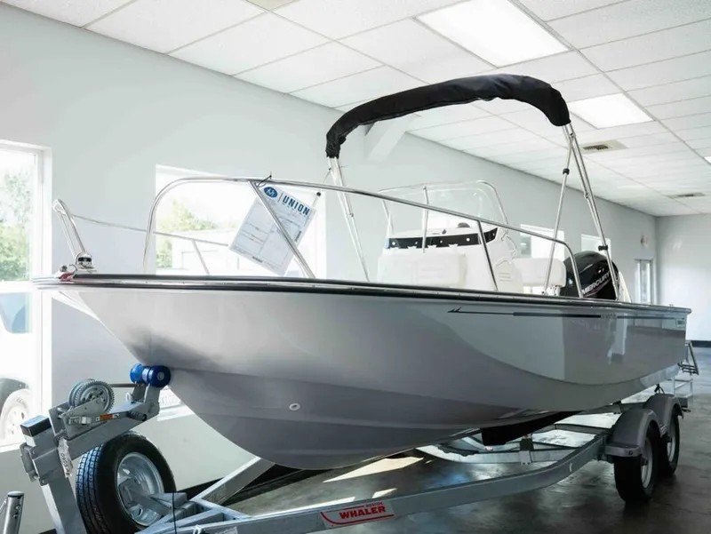 The Image of A 2027 Boston Whaler 190 Montauk on a trailer in a showroom. - 1