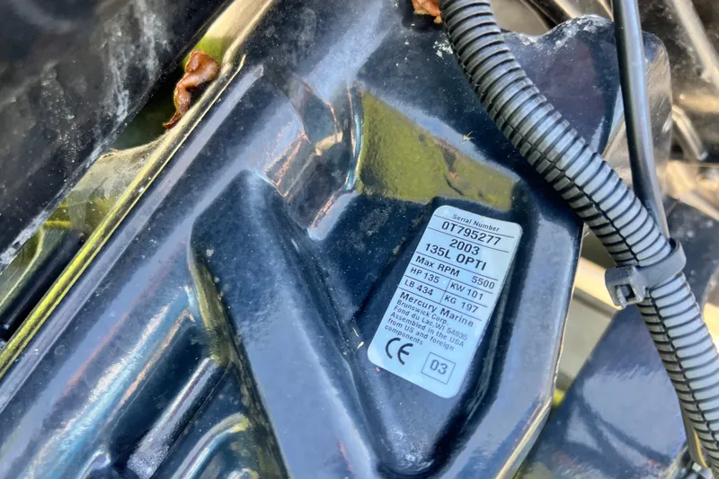 Slide: The Image of Close-up of a 2003 Mercury Marine engine label on a 1973 Boston Whaler 19 Outrage. - 25