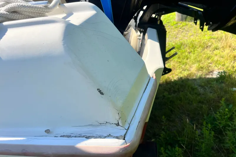 Slide: The Image of 1973 Boston Whaler 19 OUTRAGE boat with visible hull damage. - 24