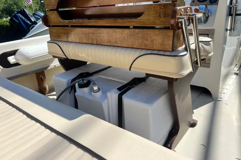 Slide: The Image of 1973 Boston Whaler 19 Outrage boat interior with seating and storage compartments. - 13