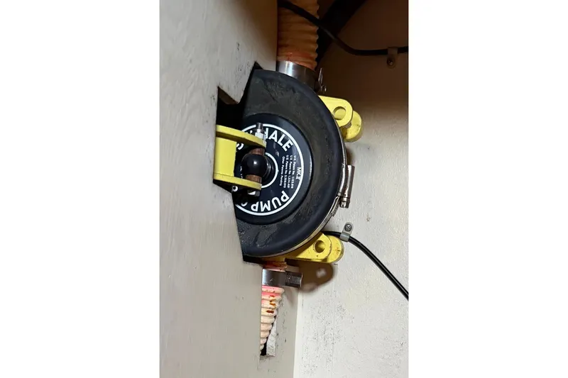 Slide: The Image of Whale pump installed in 1983 S2 9.2C sailboat, featuring yellow mounting brackets. - 14