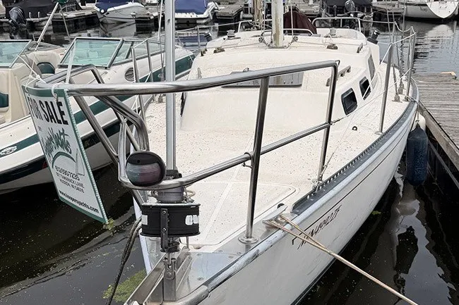 The Image of 1983 S2 9.2C sailboat docked, for sale sign visible. - 1