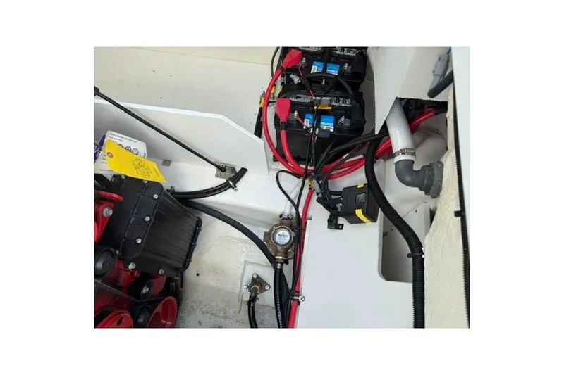Slide: The Image of Engine compartment of 2024 Cobalt R8 boat with wiring and battery setup. - 36