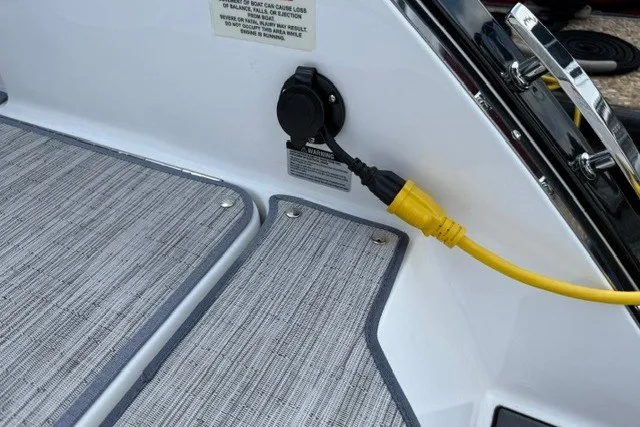 Slide: The Image of 2024 Cobalt R8 boat with yellow power cable connected on deck. - 40