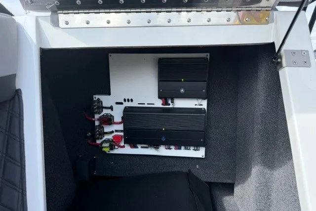 Slide: The Image of 2024 Cobalt R8 boat interior showing electronic components and wiring setup. - 44