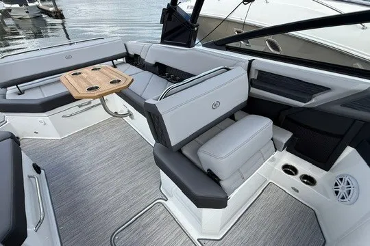 Slide: The Image of Luxurious interior of 2024 Cobalt R8 boat with sleek seating and wooden table. - 9