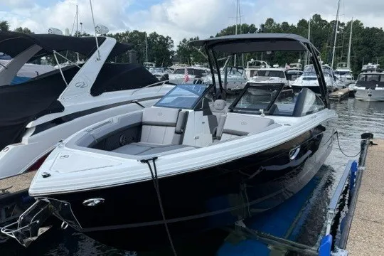 Slide: The Image of 2024 Cobalt R8 boat docked at a marina, showcasing sleek design and modern features. - 3