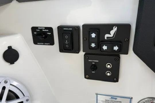 Slide: The Image of Control panel of 2024 Cobalt R8 boat with heater and seat adjustment switches. - 38
