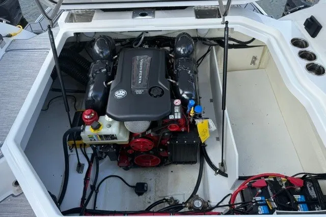 Slide: The Image of 2024 Cobalt R8 engine compartment showcasing a powerful inboard motor with detailed components. - 35